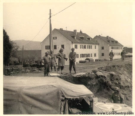 [U.S. army trucks and GIs, Grainau, Germany, May 1945: 305th Engineer Combat Battalion]