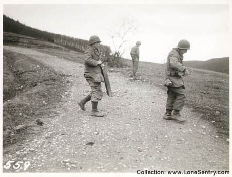 [Engineers cross a road with equipment, 305th Engineer Combat Battalion, 80th Infantry Division]