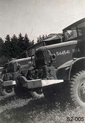 [Line of Trucks of the 995th Field Artillery Bn]