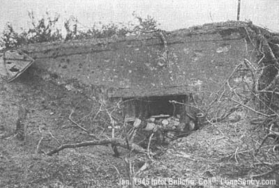 [A front view of a captured pillbox in the Siegfried Line.]