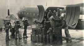 [53rd Troop Carrier Wing: loading fuel supplies]
