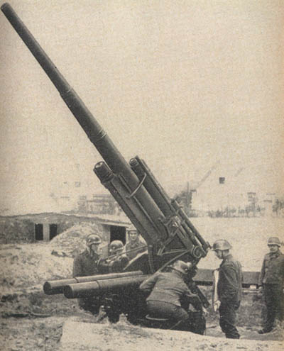 [Figure 10. 8.8-cm (88-mm) dual-purpose gun in action.]