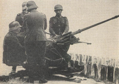 [Figure 3. 2-cm (20-mm) AA/AT gun 30 in action.]